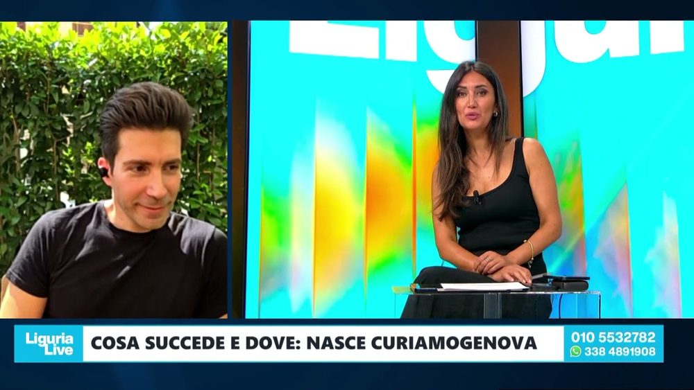 Fotogramma della trasmissione «Liguria Live» di Telenord: in studio la conduttrice e, in collegamento, il promotore di curiAMOGENOVA. In sovrimpressione la scritta «Cosa succede e dove: nasce curiAMOGENOVA».